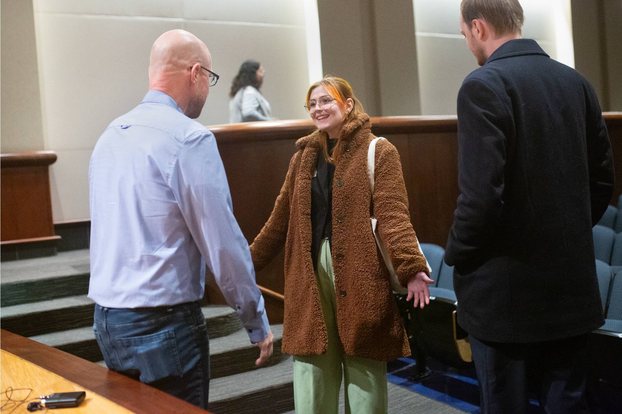 two people sitting on stage